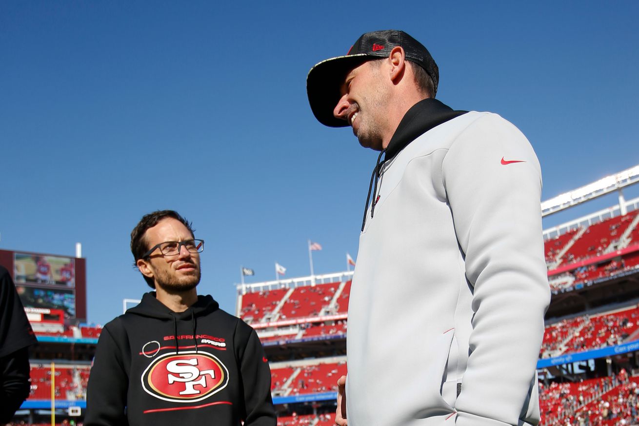 49ers offensive coordinator Mike McDaniel talking to head coach Kyle Shanahan